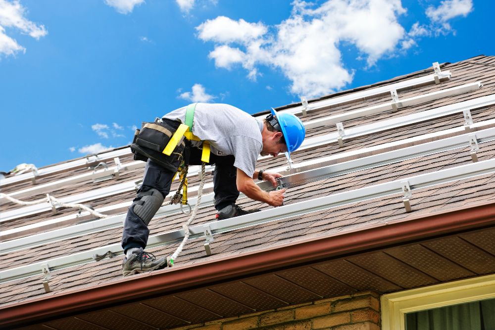 man installing steel on the roof