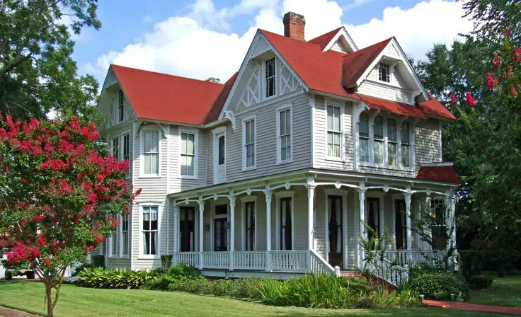 white house with red metal roof