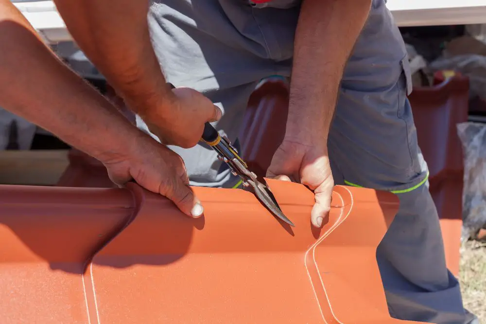 cutting metal roof using metal scissors