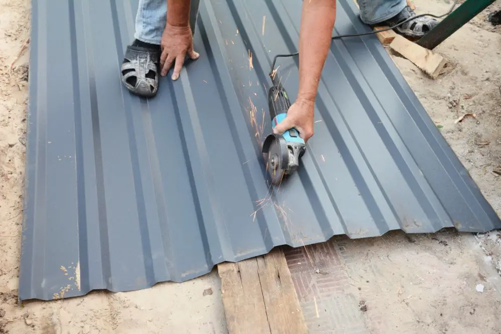 cutting blue metal roof using grinder