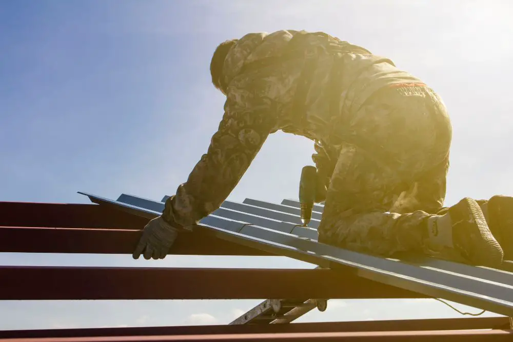 Roofer drilling the roof