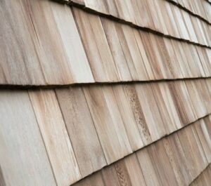Several wood cedar shingles for siding or roofs.